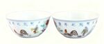 A pair of colorful chicken cups